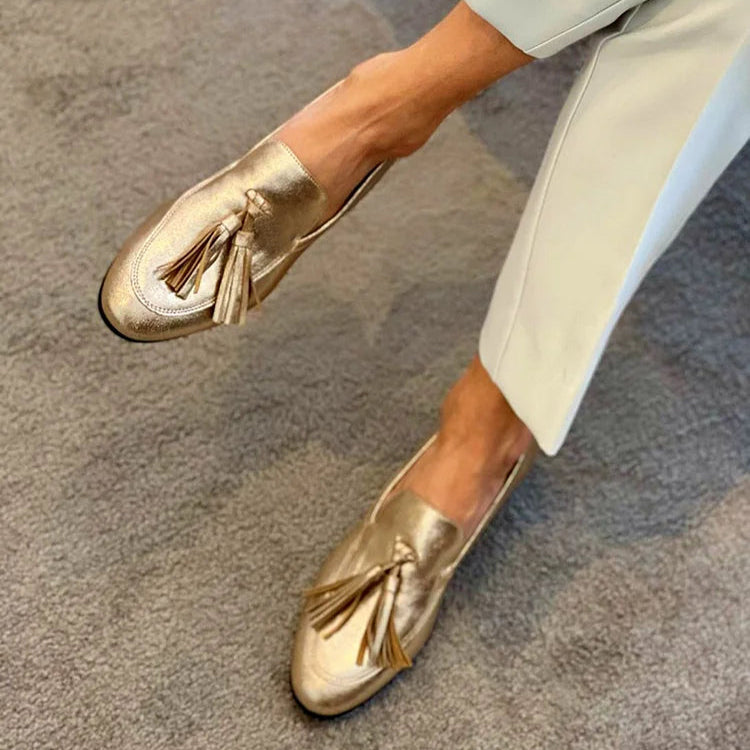 Gouden loafers met kwastjes
