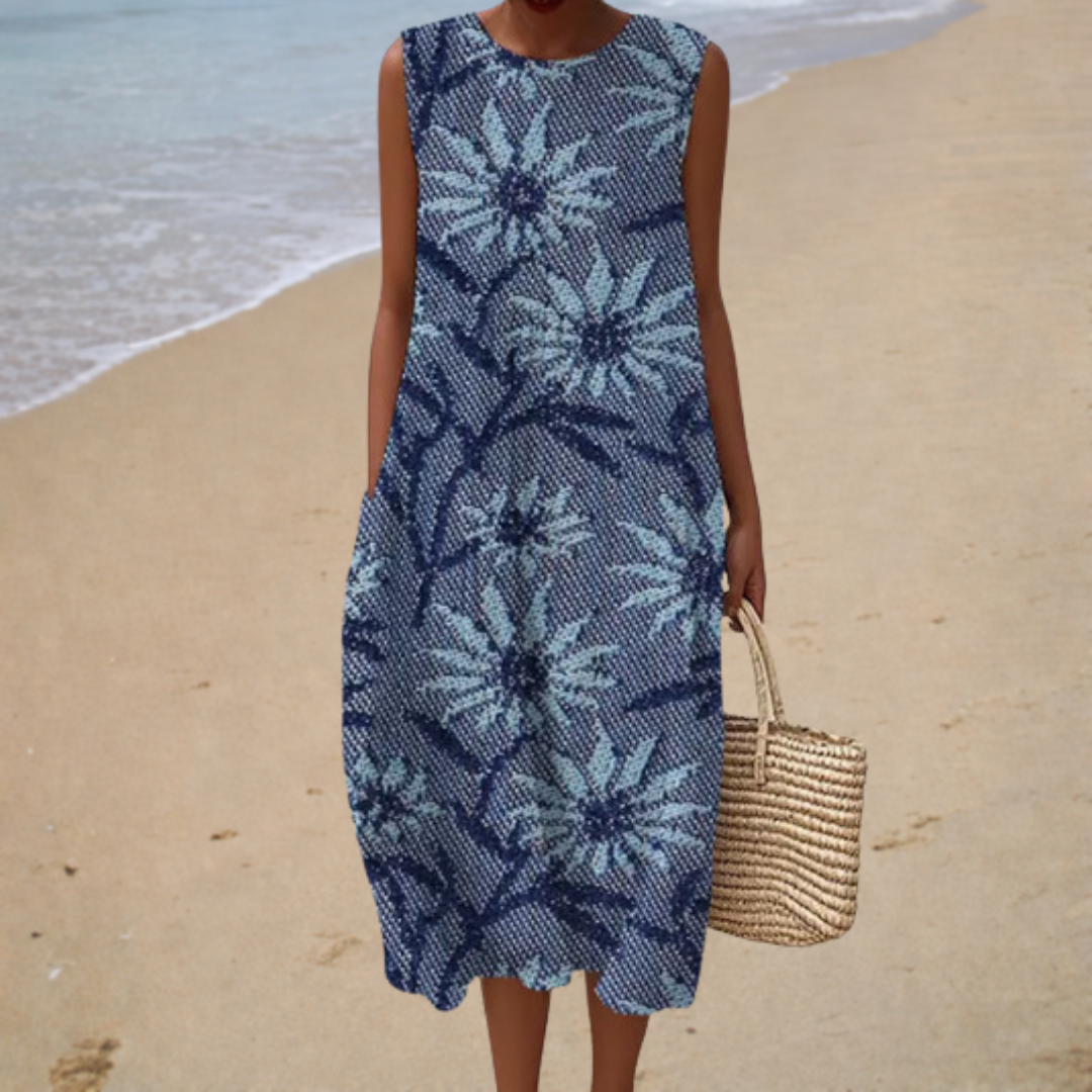 Bea mouwloze jurk met bloemen op blauw