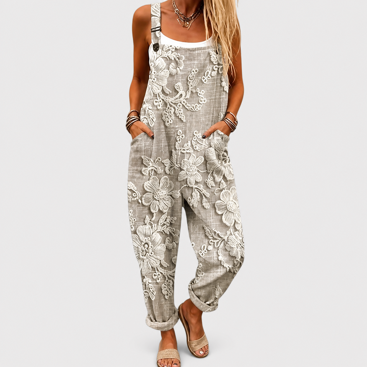 Riet zandkleurige jumpsuit met bloemdessin