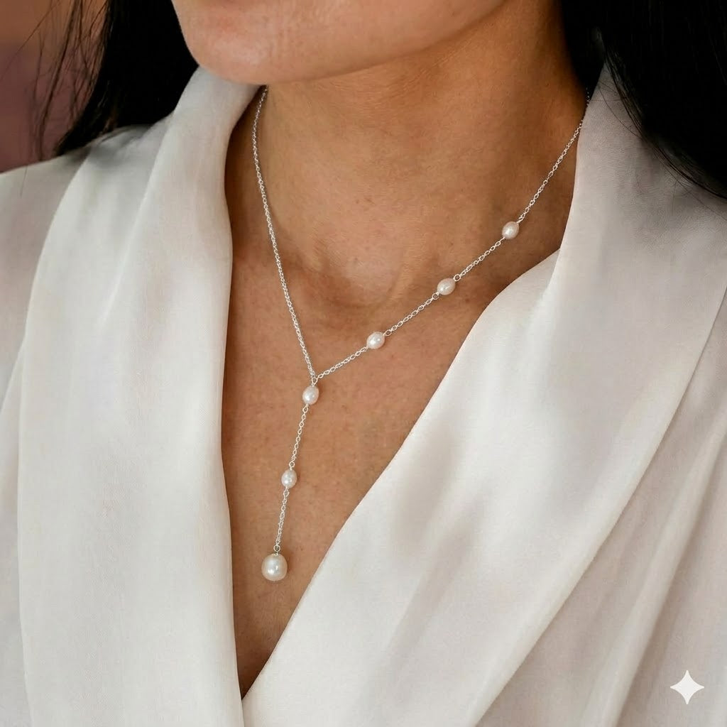 Lariat ketting met cascade van parels