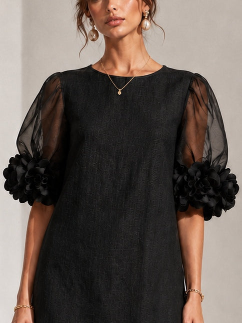 Zwarte mini-jurk van organza met pofmouwen