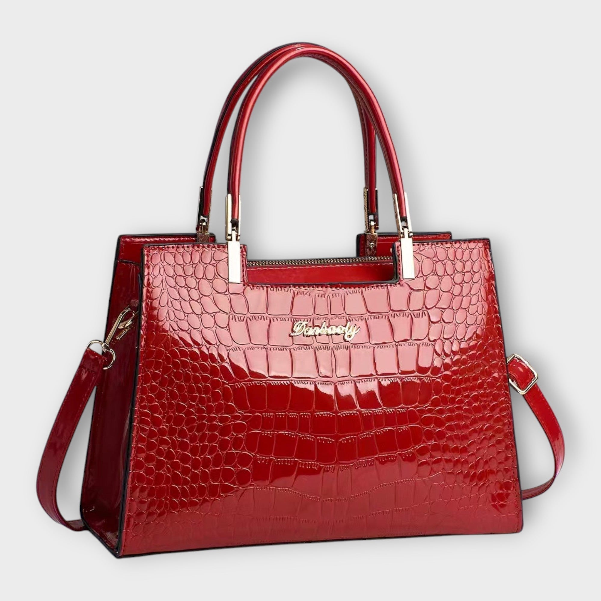 Glanzende handtas met krokodillenprint