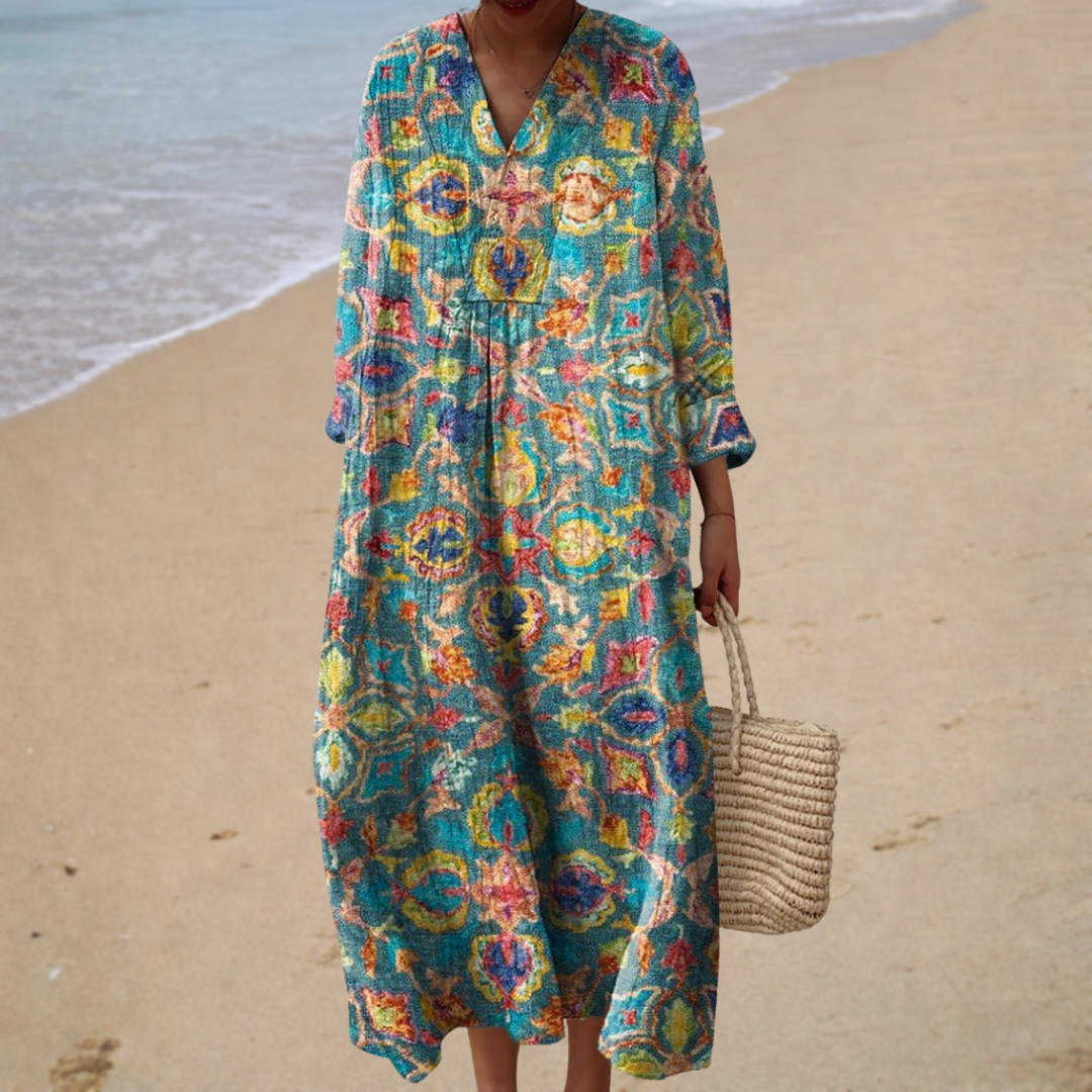 Fien jurk met bloemen op turquoise