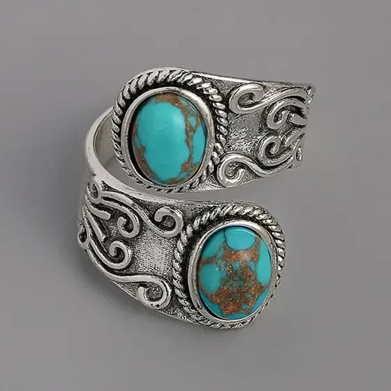 Calista gewikkelde ring in zilver met dubbel turkoois