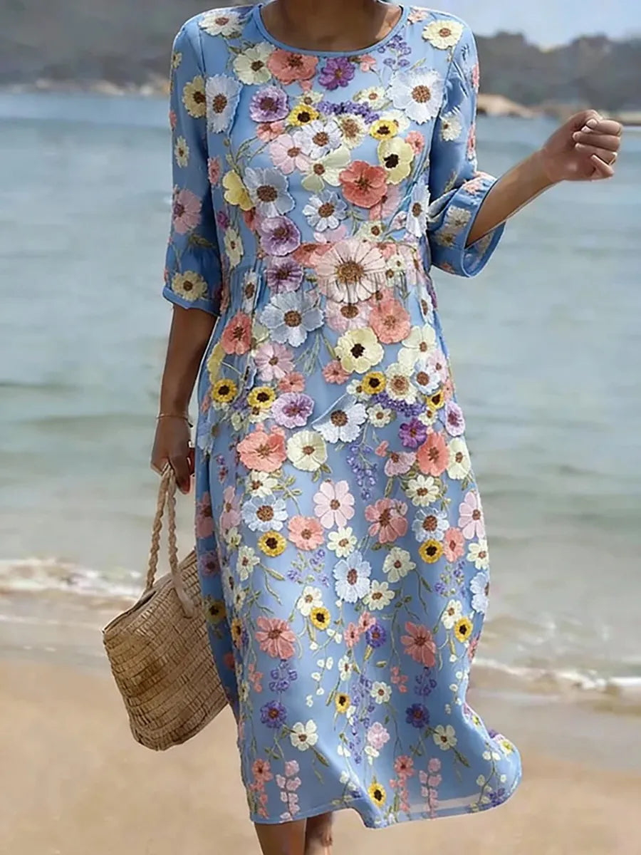 Anneke | Blauwe strandjurk met kleurrijke bloemenprint