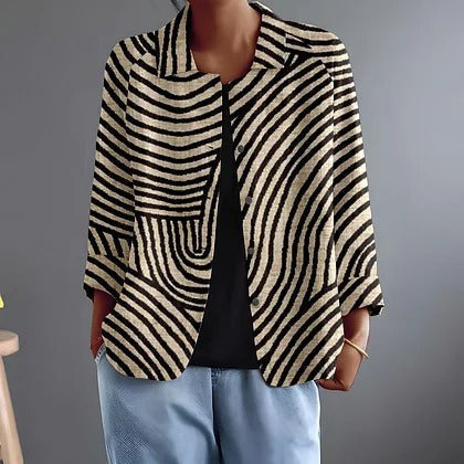 Jonquille luchtige blouse met zwarte bogen op zand