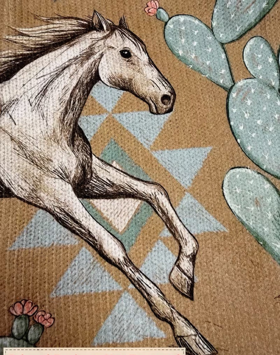 Perpetua ritsvest met woestijnpaarden en cactussen