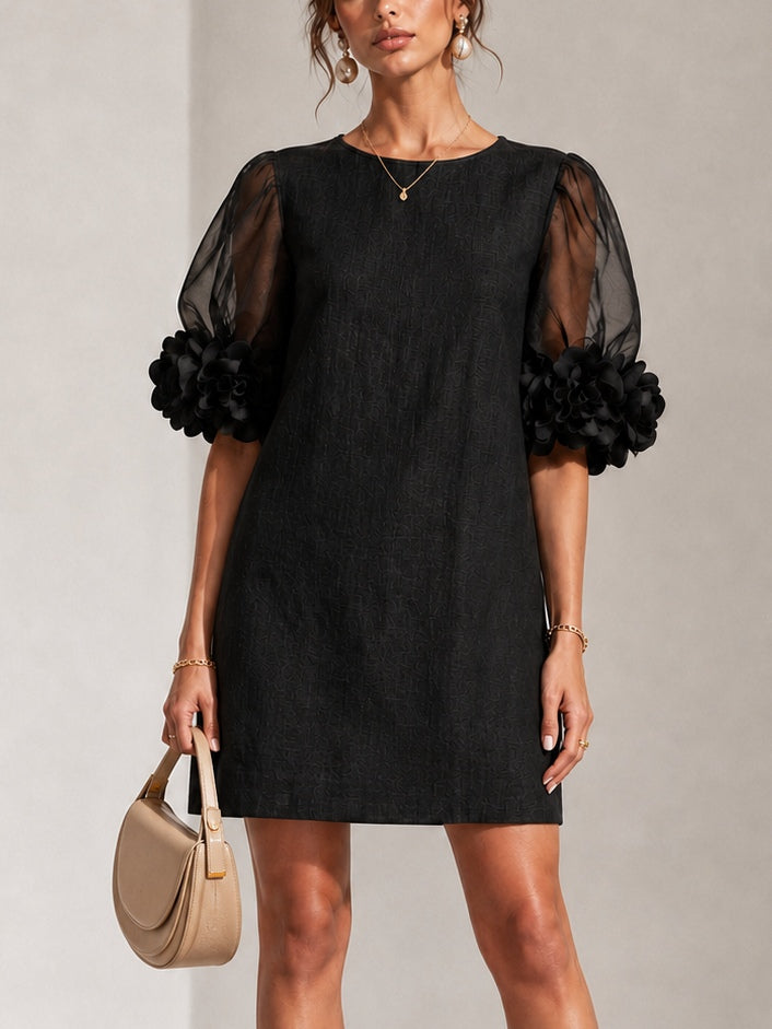 Zwarte mini-jurk van organza met pofmouwen